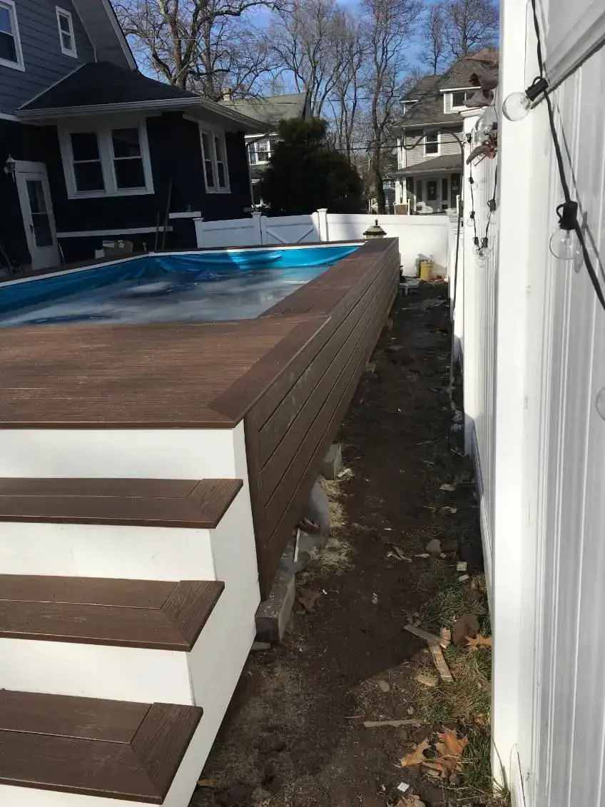 Composite Pool Deck Steps — Custom composite deck steps with white risers around pool area, Bergen County NJ