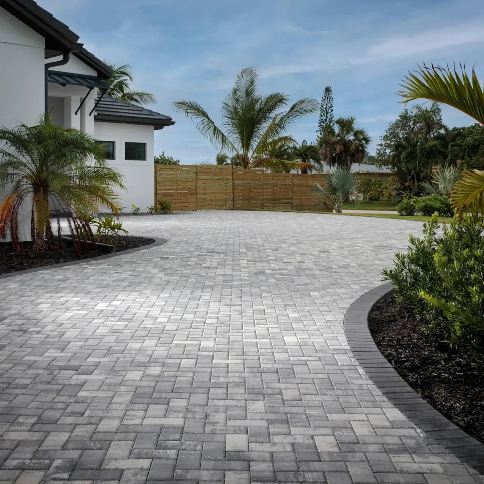 Paver Driveway — Interlocking paver driveway with curved edging and landscaping, Bergen County NJ
