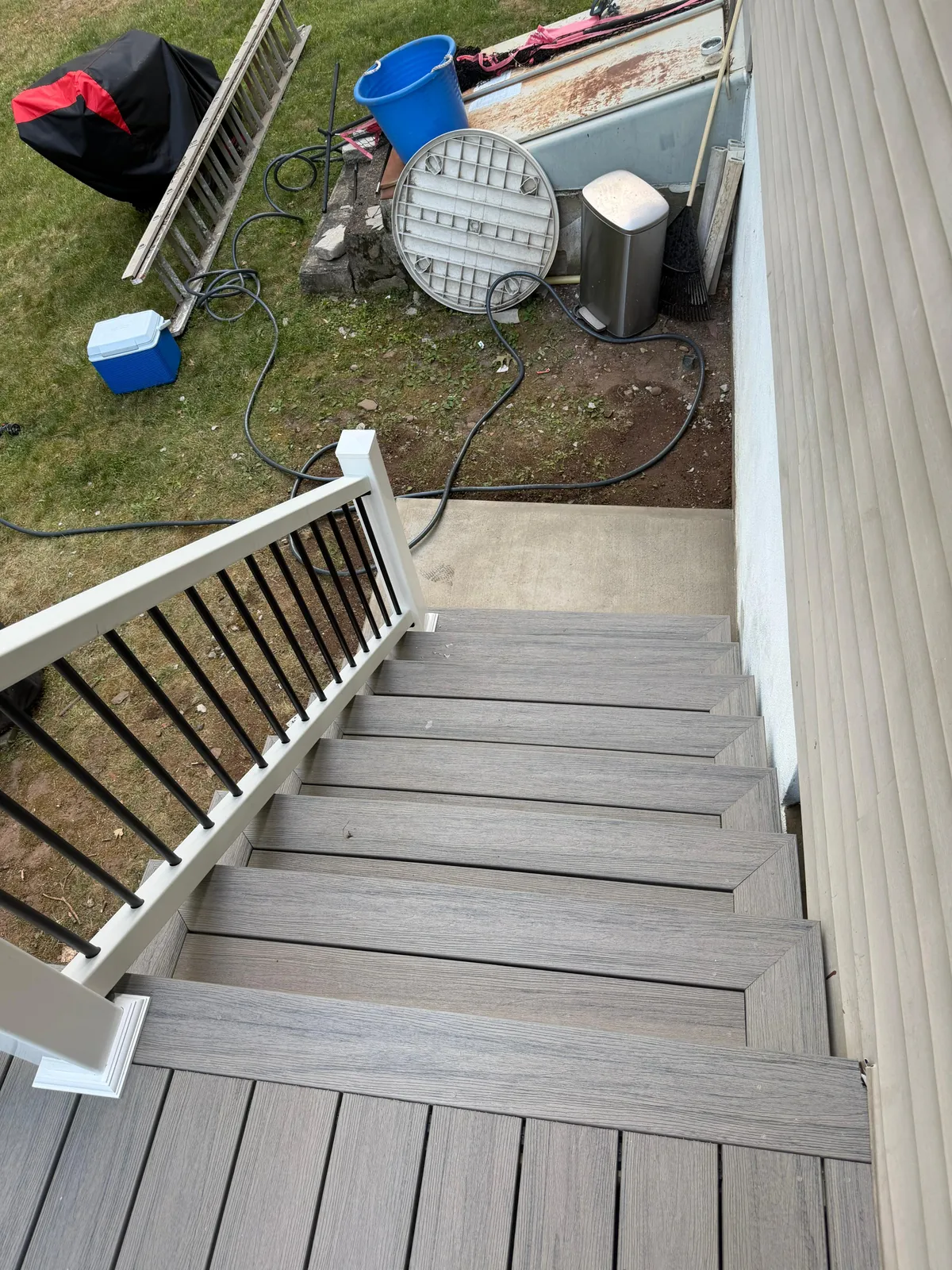 Composite Stair Installation — Top-down view of new composite stair treads during the deck build, Bergen County NJ