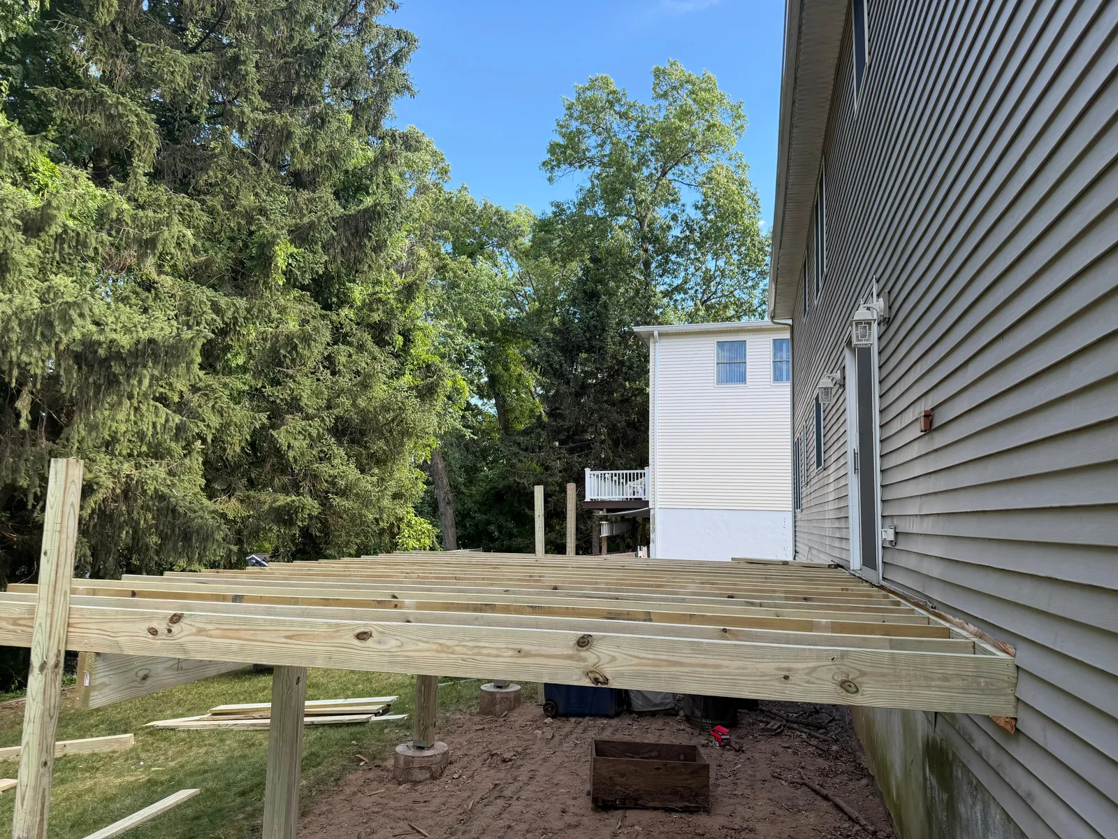 Deck Framing & Joists — Pressure-treated joist framing installed against the house before the decking goes down, Bergen County NJ