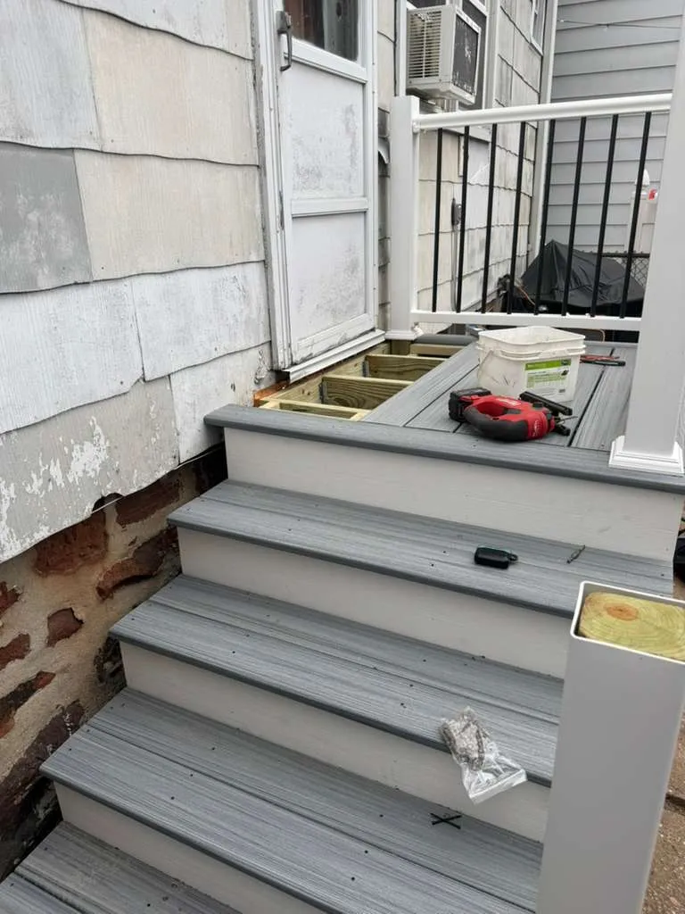 Porch Landing Installation — New composite landing and stair treads going in during the back-porch rebuild, Bergen County NJ