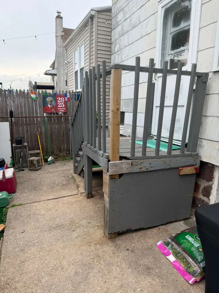 Before: Worn Wood Landing — Aged wood porch landing and railing prior to the composite rebuild, Bergen County NJ